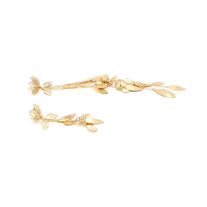 Golden asymmetrical long leaf tassel earrings with brushed metal texture on white background