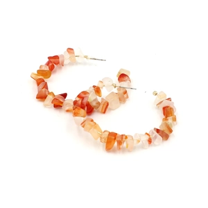 Close-up of Bohemian C-shape hoop earrings with orange natural crushed stone beads