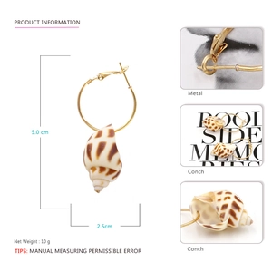 Detail view of gold conch shell hoop earrings showing texture, 5.0cm height and 2.5cm width
