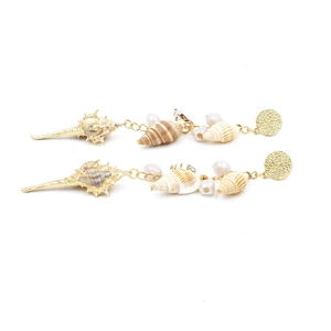 Elegant gold earrings with sea shells and long pearl tassels on a white background