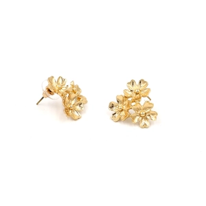 Chic golden metal flower cluster earrings with textured petals on white background
