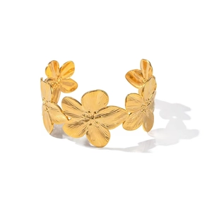 Detail of 18K gold plated cuff bracelet with textured 3D floral petals and brushed finish