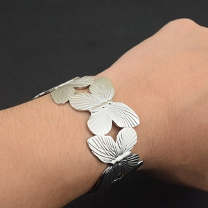 Silver butterfly linked bracelet in 18K gold plated copper with adjustable open design