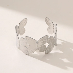 Silver butterfly open cuff bracelet with detailed brushed texture and 18K gold plating