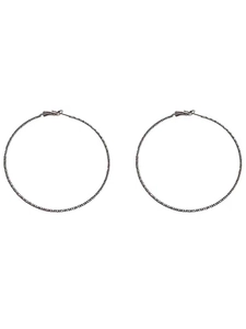 Macro detail of large round hoop earrings with fine grainy texture in dark gunmetal finish