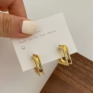 Chic gold geometric rectangular hoop earrings with distinctive vertical grooved texture