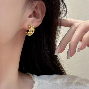 Chic 18K gold plated multi-layer C-shaped hoop earrings with textured finish on model