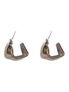 Detailed view of silver liquid metal style earrings with irregular geometric C-shape design