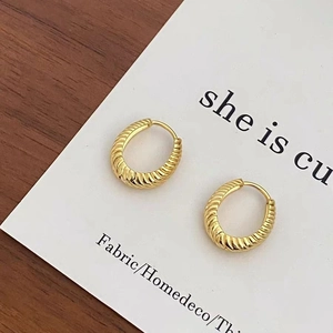 French vintage croissant style golden hoop earrings with elegant spiral textured metal