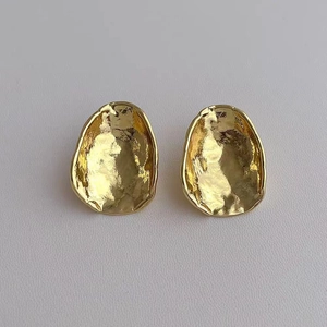 Irregular geometric gold-tone metal earrings with minimalist textured lava design for women