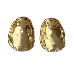 Irregular gold metal geometric earrings with hammered texture and a mirrored finish