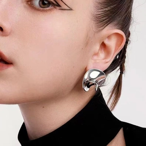 Minimalist silver abstract liquid metal earrings with polished irregular spiral design