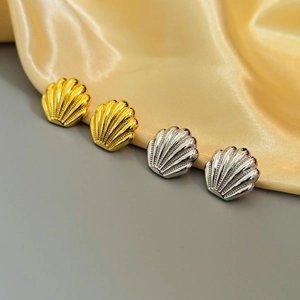 French retro shell earrings in gold and silver finish with elegant polished texture
