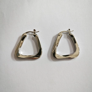 Silver metallic irregular twisted triangle hoop earrings with a high-polished mirror finish
