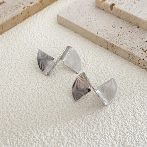 Abstract silver geometric twisted earrings with vertical brushed metal texture for women