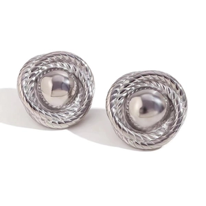 Detail shot of silver stud earrings with a central sphere and rope texture border