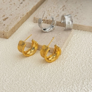 Textured 18K gold and silver plated C-shape hoop earrings with irregular wave pattern