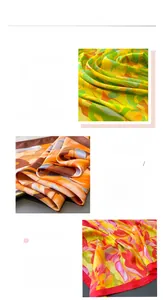 Detailed view of luxury silk satin scarf with floral prints and red rolled edge finish