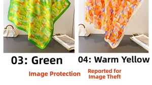 Detailed close-up of green and warm yellow floral print silk scarves with smooth texture