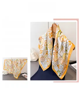 Detail of vintage floral silk scarf featuring palm tree and checkerboard patterns