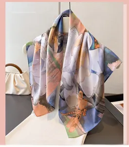 Detailed view of silk-feel scarf featuring dragonfly and purple floral artistic print