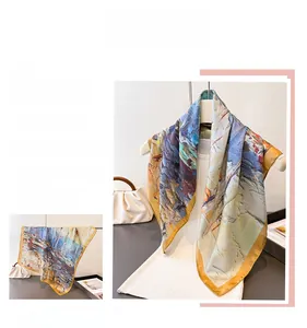 Detailed view of ocean oil painting silk scarf with elegant yellow rolled edges