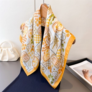 Elegant silk-like square scarf with retro tropical print and bright orange border