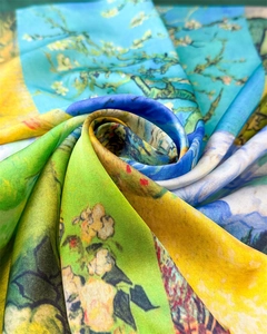 Macro detail of silk scarf featuring Van Gogh almond blossom print with satin texture