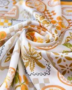 Detailed macro view of the printed silk scarf featuring Mediterranean SARDINIA patterns