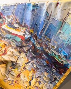 Detail of oil painting style silk scarf with thick impasto brushstrokes and gold rolled edges