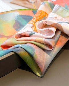 Detailed close-up of lotus pond dragonfly print scarf with silky texture and fine stitching
