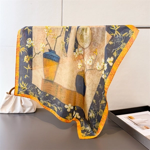 Artistic oil painting silk scarf with blue and yellow floral pattern hanging on a rack