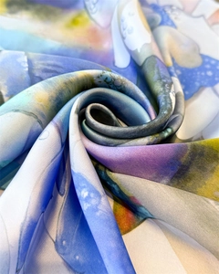 Macro view of silky lotus dragonfly scarf showing artistic watercolor texture and drape