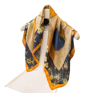 Artistic oil painting silk scarf with floral patterns draped on a white model stand