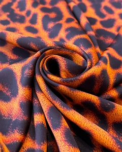 Macro shot of high-end leopard print silk scarf with luxury satin texture and vibrant colors