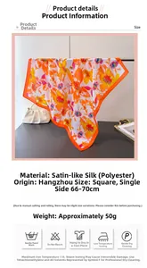 Detailed view of square satin scarf showing vibrant orange and purple floral patterns