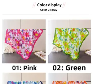 Floral print silk scarves display in pink and green colors with elegant satin texture