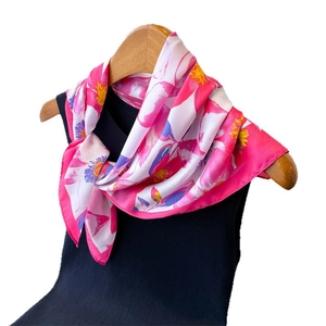 Elegant floral silk-feel square scarf with pink abstract patterns shown on hanger