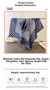 Polka dot navy blue silk scarf detail showing fabric texture, 70cm size, and care labels