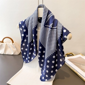 Navy blue polka dot silk-like square scarf with elegant woven pattern for women