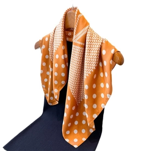 Elegant orange silk-like square scarf with polka dot and geometric patterns for women