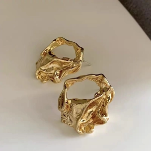 Irregular hollow geometric stud earrings with gold lava texture and metallic finish