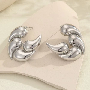 Polished silver teardrop geometric earrings with a modern layered fluid design