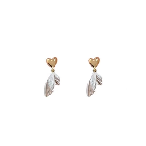 Fashionable gold heart and silver fishtail drop earrings with a bicolor metal finish