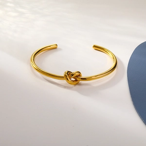 Minimalist gold knot open cuff bracelet with polished finish in modern ins style