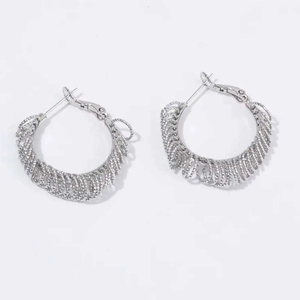 Chic silver spiral textured hoop earrings with a minimalist multi-layered coiled metal design
