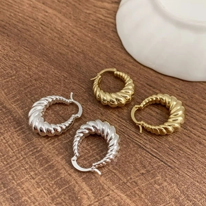 Minimalist geometric twisted horn earrings in gold and silver finish for women