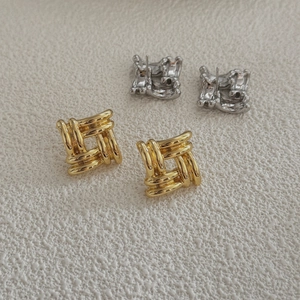 Minimalist square braided stud earrings in gold and silver finishes on textured background