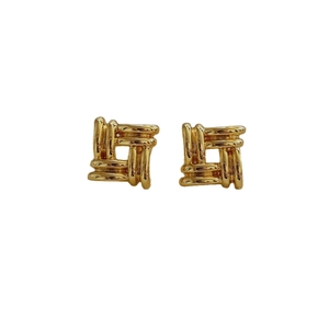 Elegant gold square earrings with vintage woven texture design on a clean white background