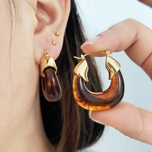 Amber resin teardrop earrings with wavy gold metal trim for women fashion accessories
